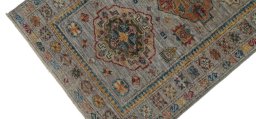 Backside of handmade New Kazak rug showing knot structure and weave density