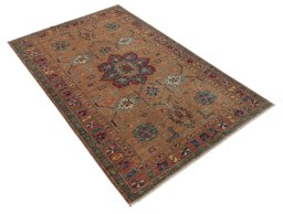 Corner detail of New Kazak rug showing border pattern and Wool pile