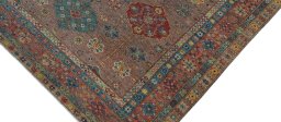 Backside of handmade New Kazak rug showing knot structure and weave density