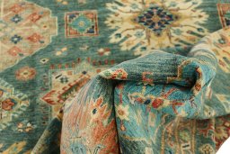 Backside of handmade New Kazak rug showing knot structure and weave density