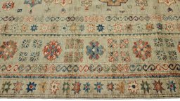 Corner detail of New Kazak rug showing border pattern and Wool pile