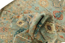 Backside of handmade New Kazak rug showing knot structure and weave density