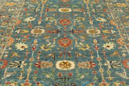 Backside of handmade New Kazak rug showing knot structure and weave density