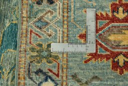 Backside of handmade New Kazak rug showing knot structure and weave density