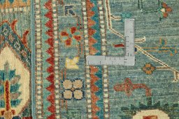 Backside of handmade New Kazak rug showing knot structure and weave density