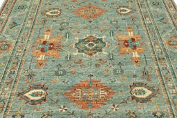 Backside of handmade New Kazak rug showing knot structure and weave density