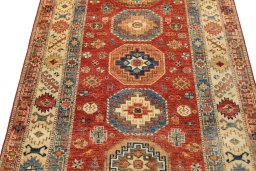Backside of handmade New Kazak rug showing knot structure and weave density