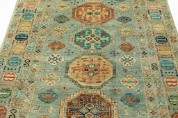 Backside of handmade New Kazak rug showing knot structure and weave density