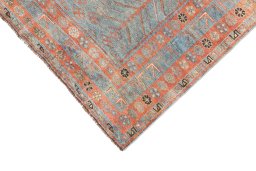 Backside of handmade 1920s Oushak rug showing knot structure and weave density