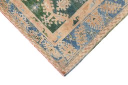 Backside of handmade 1920s Oushak rug showing knot structure and weave density