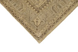 Backside of handmade 1920s Oushak rug showing knot structure and weave density