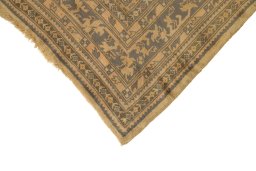Backside of handmade 1920s Oushak rug showing knot structure and weave density