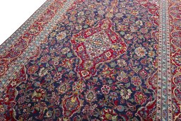 Backside of handmade 2000s Kashan rug showing knot structure and weave density