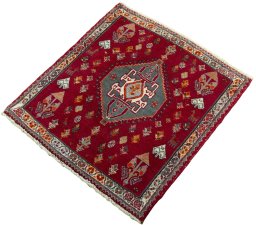 Corner detail of 2000s Shiraz rug showing border pattern and Wool pile