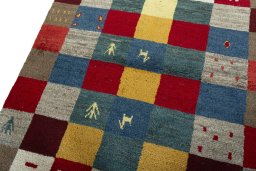 Backside of handmade 2000s Persian Gabbeh rug showing knot structure and weave density