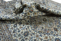 Surface texture of 2000s Kashan rug with natural Wool and intricate pattern
