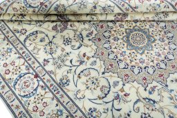 Close-up detail of 2000s Nain rug from Iran / Persia showing Wool weave