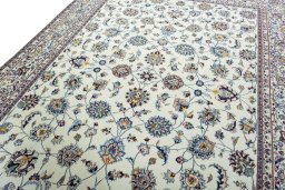Backside of handmade 2000s Mashad rug showing knot structure and weave density