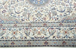 Corner detail of 2000s Nain rug showing border pattern and Wool pile