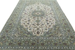 Surface texture of 2000s Kashan rug with natural Wool and intricate pattern