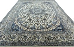 Surface texture of 2000s Nain rug with natural Wool and intricate pattern