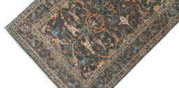 Backside of handmade New Farahan rug showing knot structure and weave density