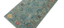 Backside of handmade New Farahan rug showing knot structure and weave density