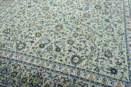 Close-up detail of 2000s Kashan rug from Iran / Persia showing Wool weave