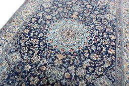 Backside of handmade 2000s Nain rug showing knot structure and weave density