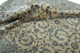 Surface texture of 2000s Kashan rug with natural Cork and intricate pattern