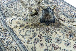 Surface texture of 2000s Nain rug with natural Wool and intricate pattern