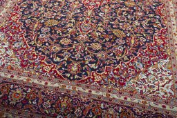 Close-up detail of 2000s Kashan rug from Iran / Persia showing Wool weave