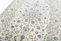 Backside of handmade New Kashan rug showing knot structure and weave density