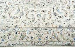 Corner detail of New Kashan rug showing border pattern and Wool pile