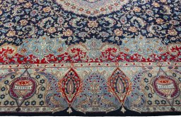 Corner detail of 1970s Kashmar rug showing border pattern and Wool pile