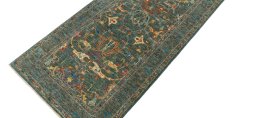 Backside of handmade New Farahan rug showing knot structure and weave density