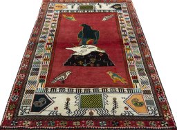 Surface texture of 2000s Persian Gabbeh rug with natural Wool and intricate pattern