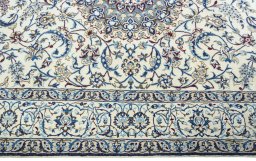 Corner detail of 2000s Nain rug showing border pattern and Wool pile
