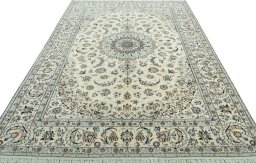 Surface texture of 2000s Nain rug with natural Wool and intricate pattern