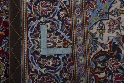 Backside of handmade 2000s Kashan rug showing knot structure and weave density