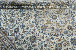 Close-up detail of 2000s Kashan rug from Iran / Persia showing Wool weave