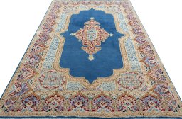 Surface texture of 2000s Kerman rug with natural Wool and intricate pattern