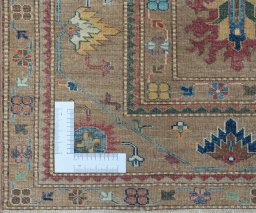 Corner detail of New Kazak rug showing border pattern and Wool pile