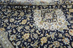 Close-up detail of 2000s Kashan rug from Iran / Persia showing Wool weave