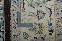 Backside of handmade 2000s Nain rug showing knot structure and weave density