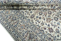 Close-up detail of 2000s Kashan rug from Iran / Persia showing Wool weave