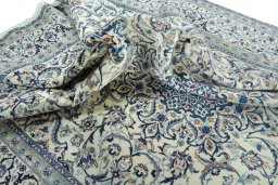 Surface texture of 2000s Nain rug with natural Wool and intricate pattern