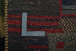 Close-up detail of 2000s Persian Gabbeh rug from Pakistan showing Wool weave