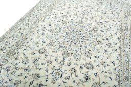 Backside of handmade New Kashan rug showing knot structure and weave density
