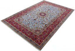 Corner detail of 2000s Kashan rug showing border pattern and Wool pile